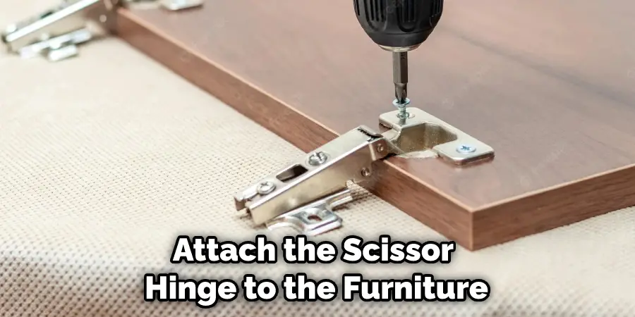 Attach the Scissor  Hinge to the Furniture