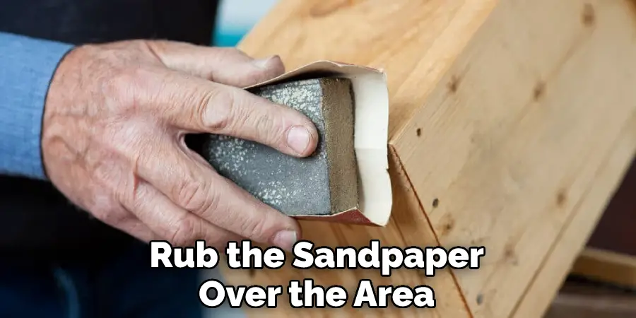 Rub the Sandpaper Over the Area