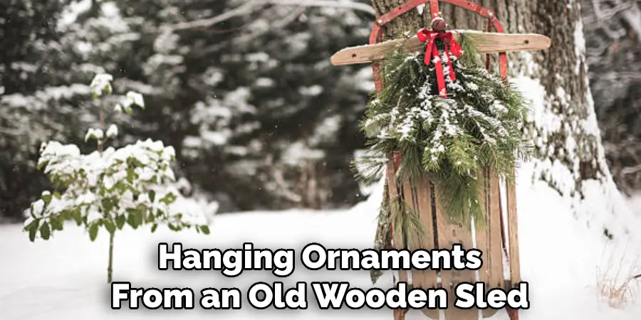 Hanging Ornaments From an Old Wooden Sled