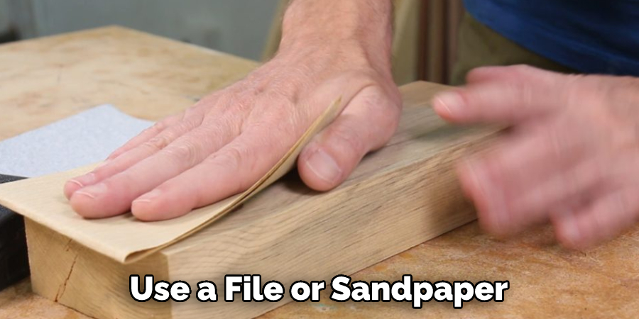 Use a File or Sandpaper