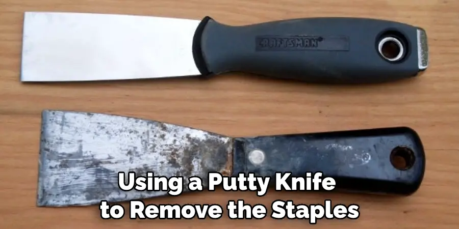 Using a Putty Knife to Remove the Staples