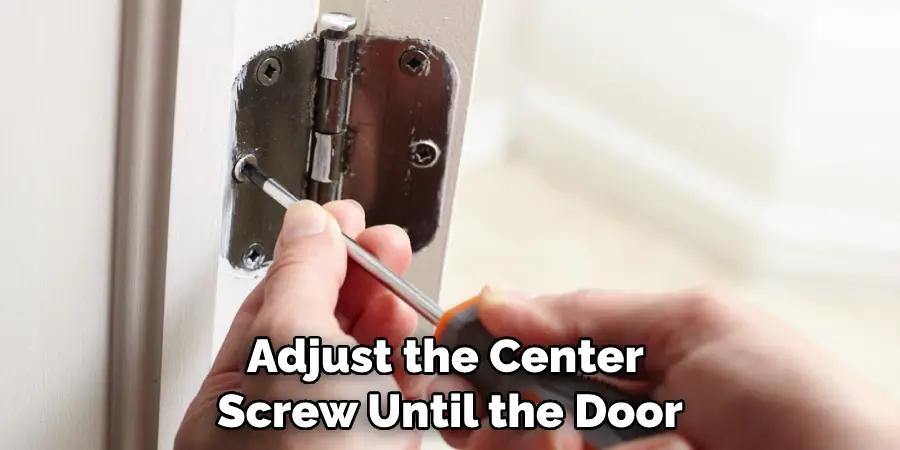 Adjust the Center Screw Until the Door