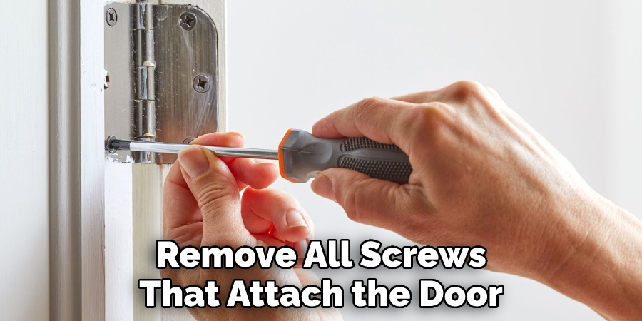 Remove All Screws That Attach the Door