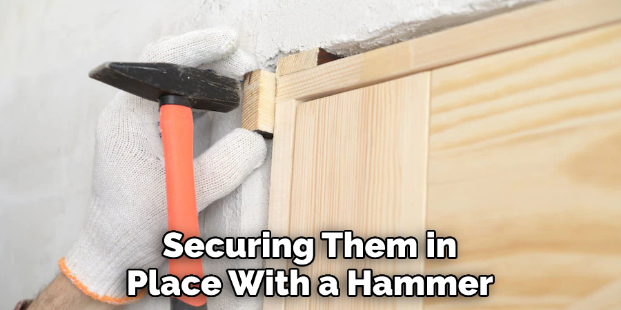 Securing Them in Place With a Hammer