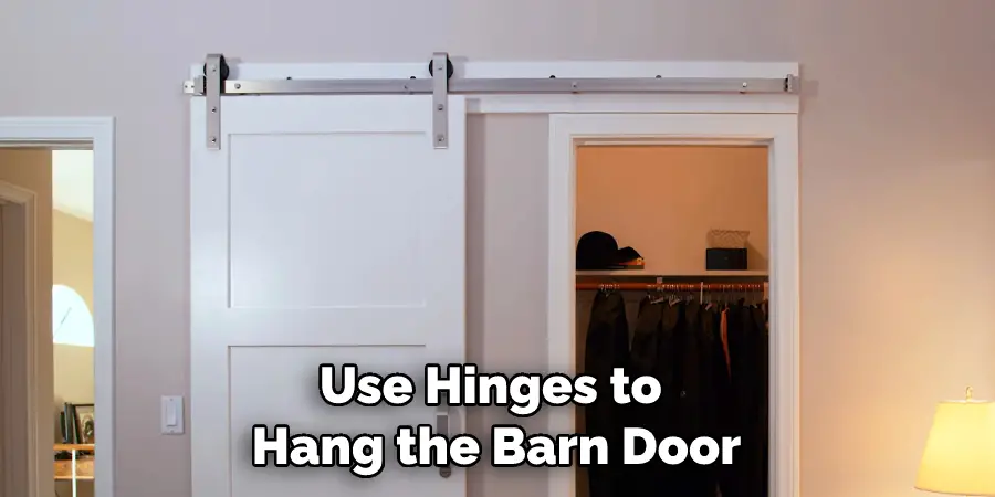 Use Hinges to Hang the Barn Door