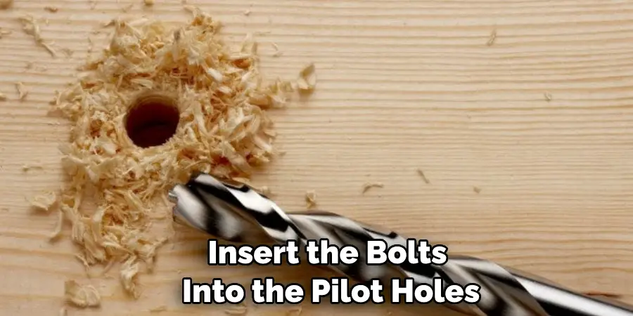 Insert the Bolts Into the Pilot Holes