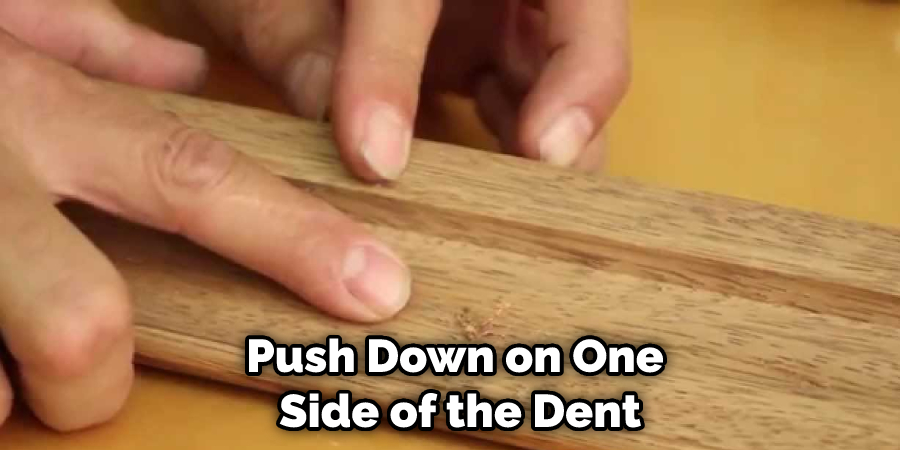 Push Down on One Side of the Dent