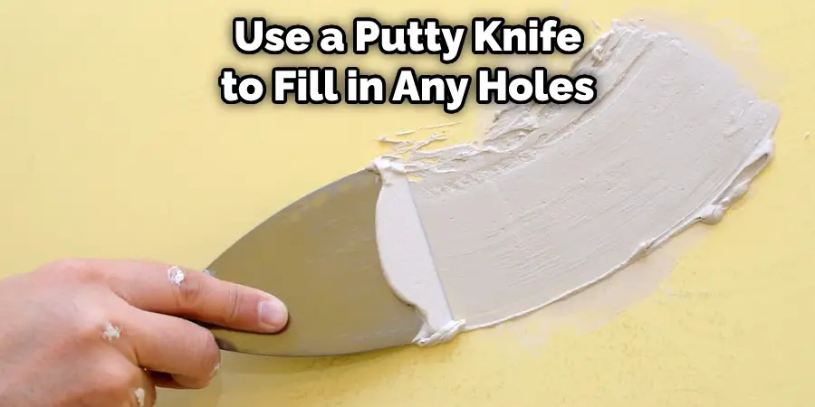  Use a Putty Knife to Fill in Any Holes