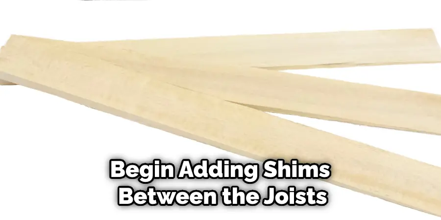 Begin Adding Shims Between the Joists