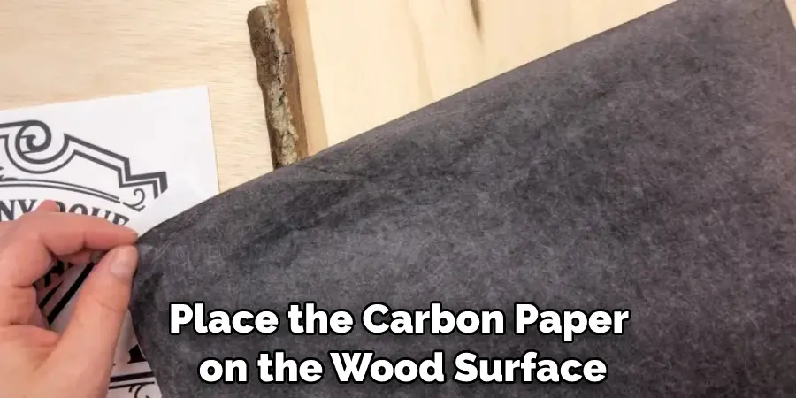 Place the Carbon Paper on the Wood Surface