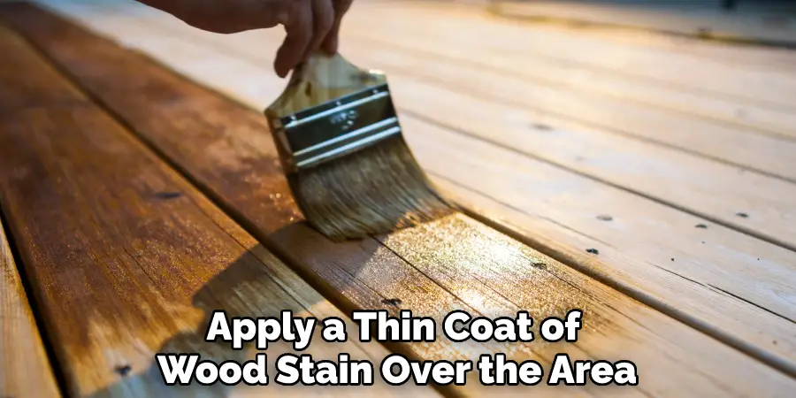 Apply a Thin Coat of Wood Stain Over the Area