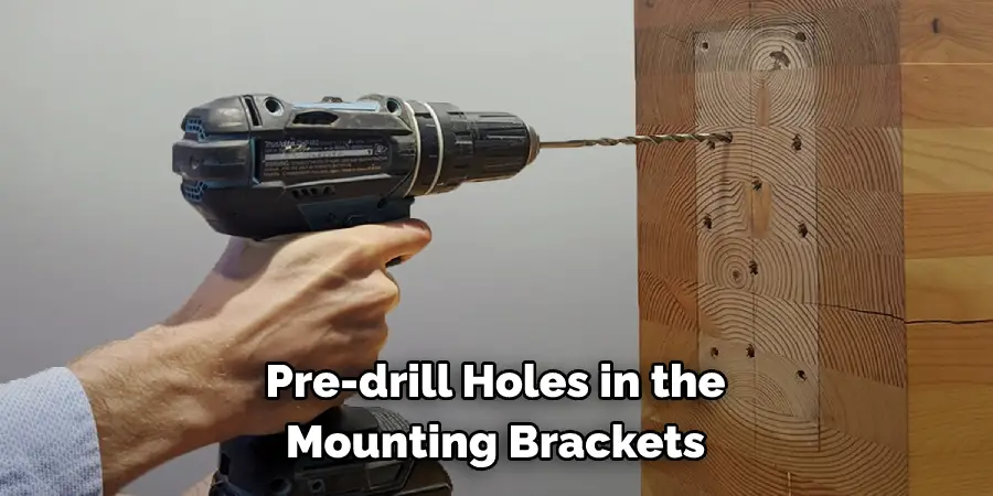 Pre-drill Holes in the Mounting Brackets
