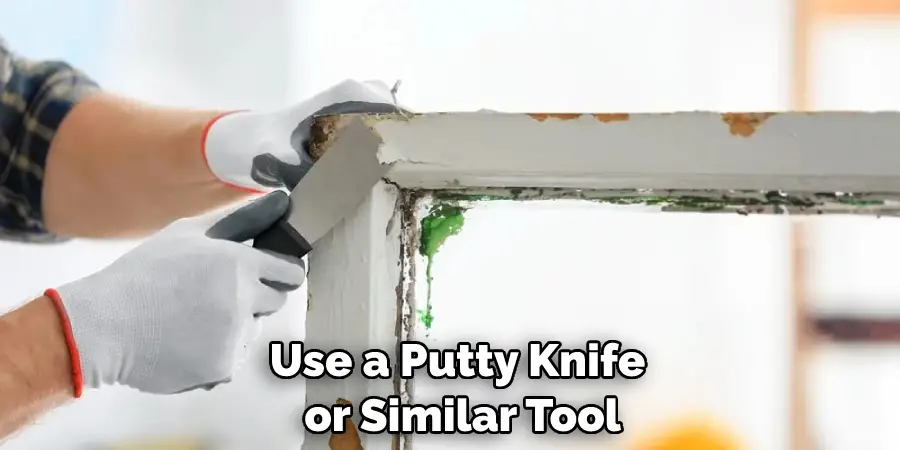 Use a Putty Knife or Similar Tool