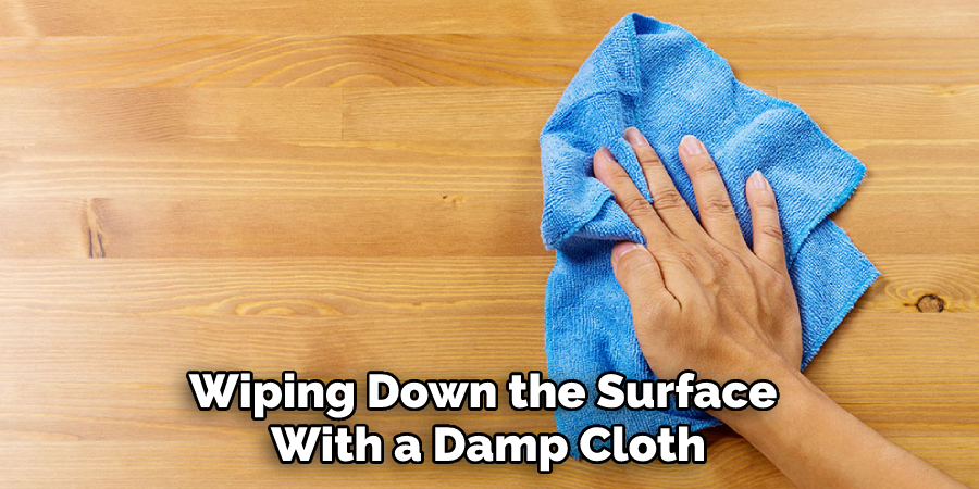 Wiping Down the Surface With a Damp Cloth