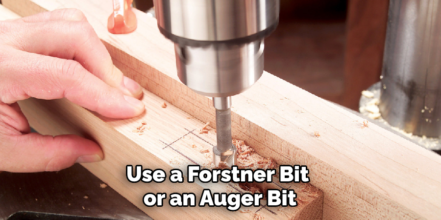 use a Forstner bit or an auger bit