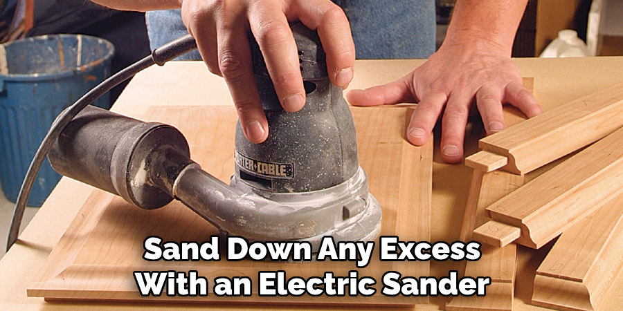 Sand Down Any Excess With an Electric Sander