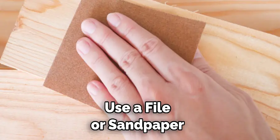 Use a File or Sandpaper