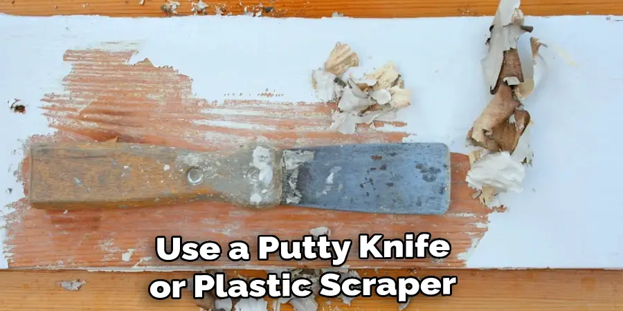 Use a Putty Knife or Plastic Scraper