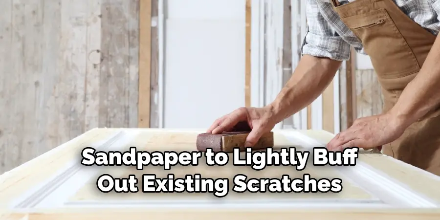 Sandpaper to Lightly Buff Out Existing Scratches