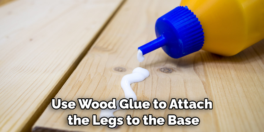 Use Wood Glue to Attach the Legs to the Base