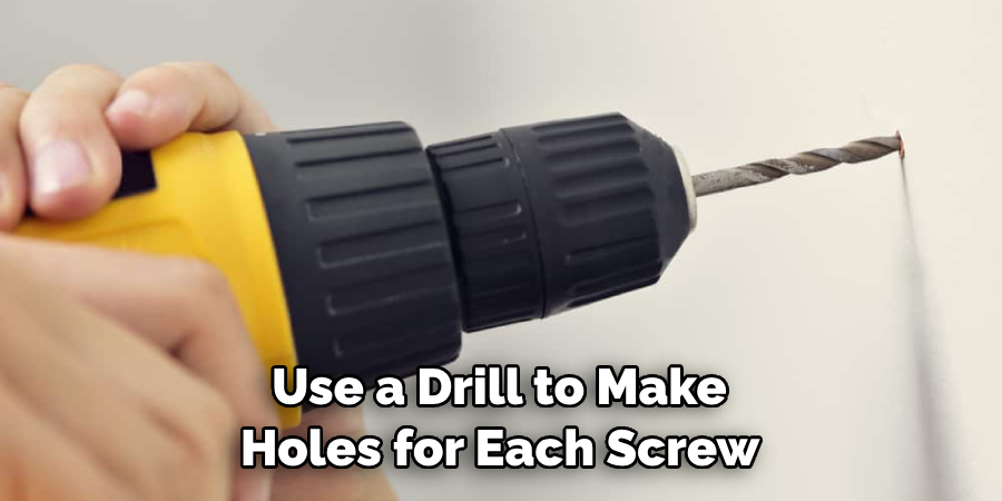 Use a Drill to Make Holes for Each Screw 