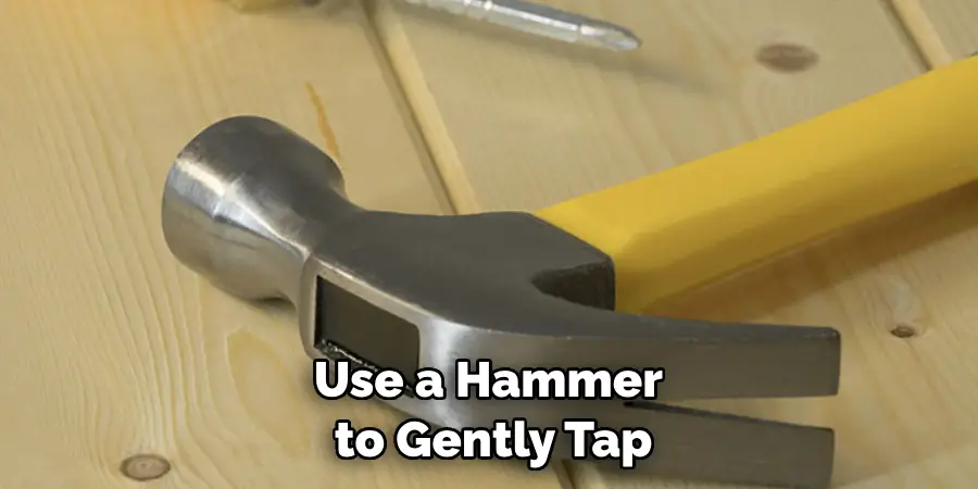 Use a Hammer to Gently Tap