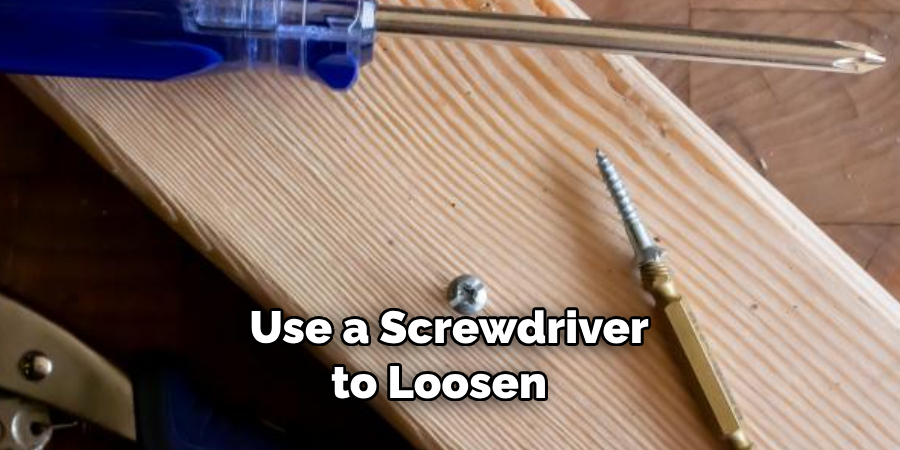  Use a Screwdriver to Loosen 