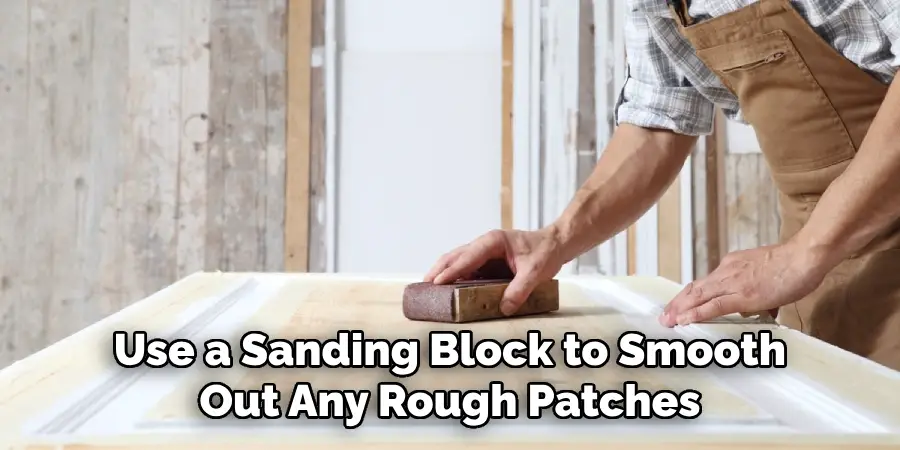 Use a Sanding Block to Smooth Out Any Rough Patches