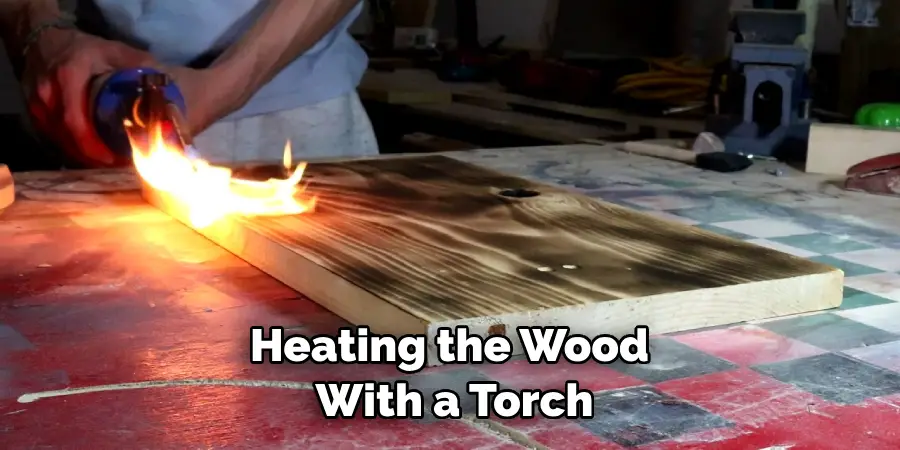 Heating the Wood With a Torch