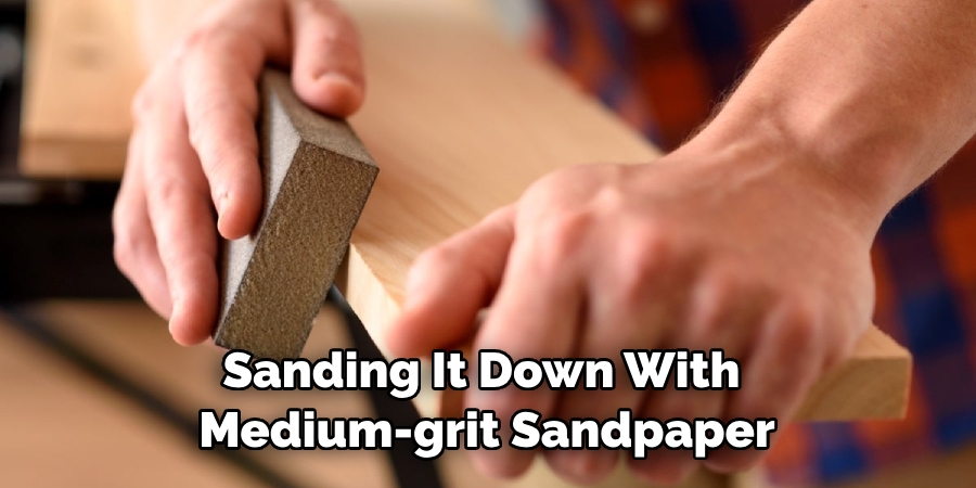 Sanding It Down With Medium-grit Sandpaper