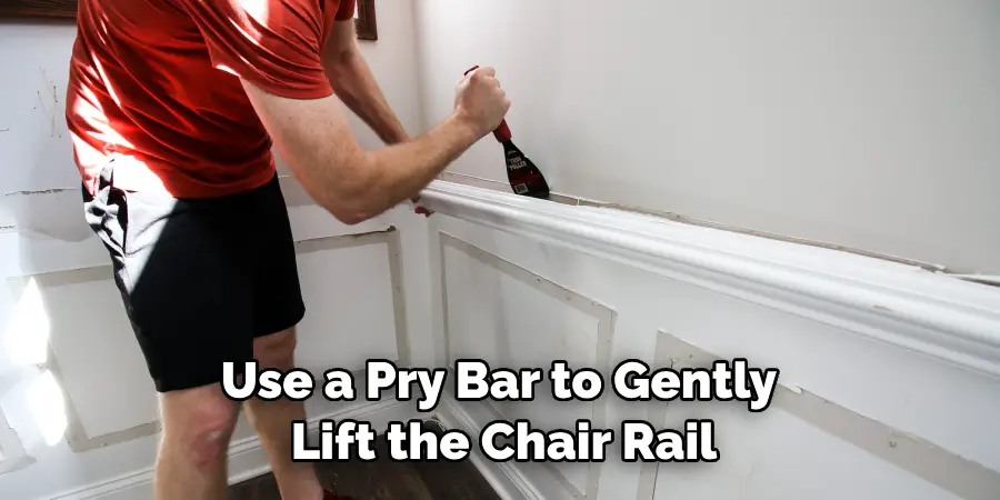 Use a Pry Bar to Gently Lift the Chair Rail