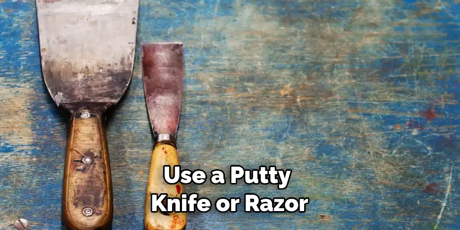 Use a Putty Knife or Razor