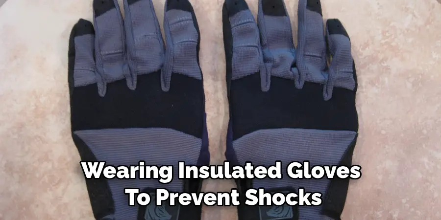 Wearing Insulated Gloves to Prevent Shocks