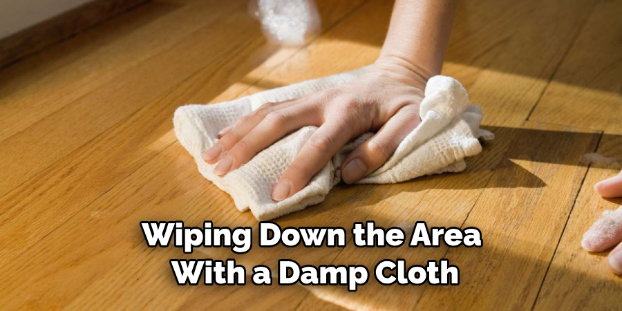 Wiping Down the Area With a Damp Cloth