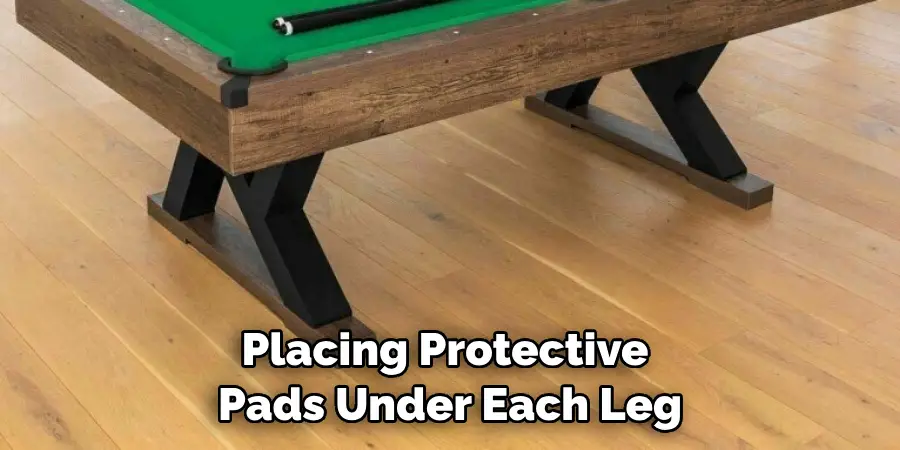 Placing Protective Pads Under Each Leg