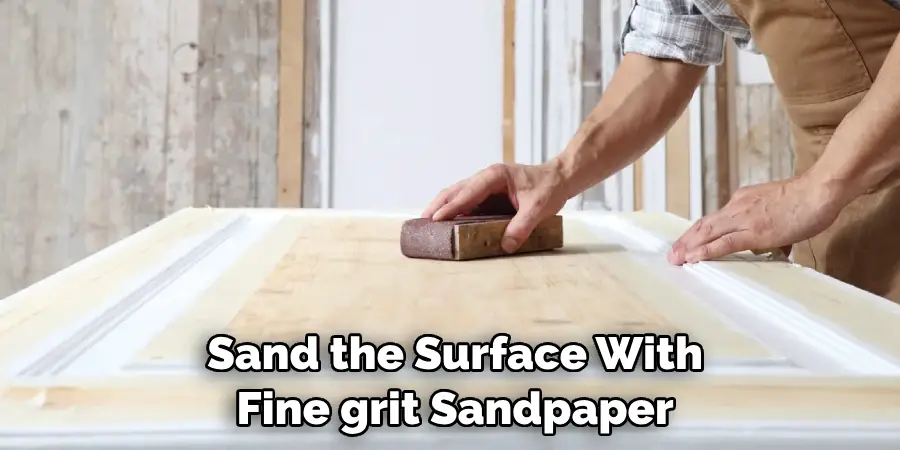 Sand the Surface With
 Fine grit Sandpaper