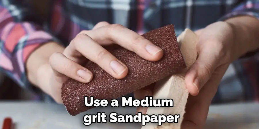 Use a Medium-grit Sandpaper