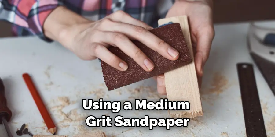 Using a Medium Grit Sandpaper