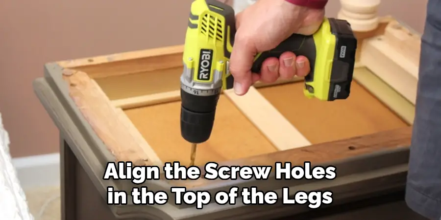 Align the Screw Holes in the Top of the Legs