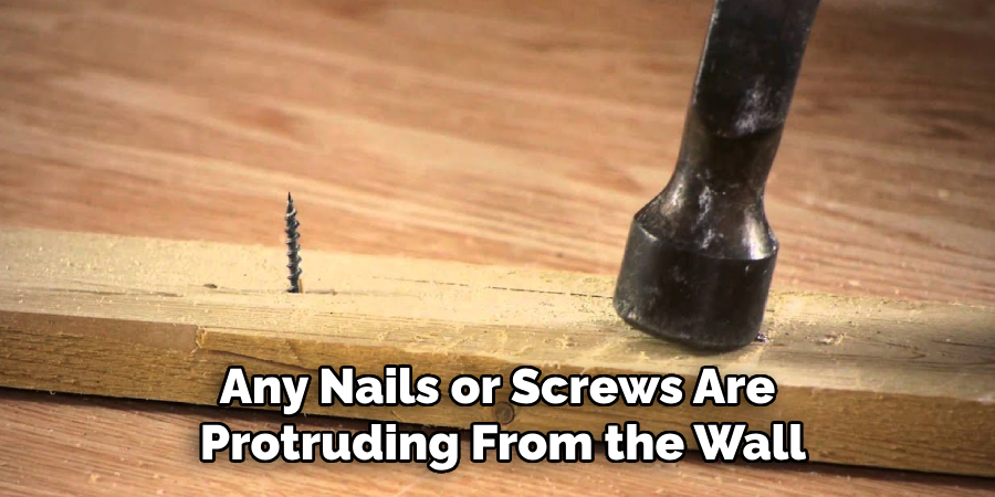 Any Nails or Screws Are Protruding From the Wall
