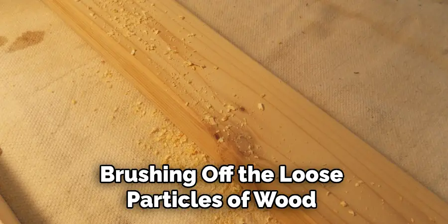 Brushing Off the Loose Particles of Wood 