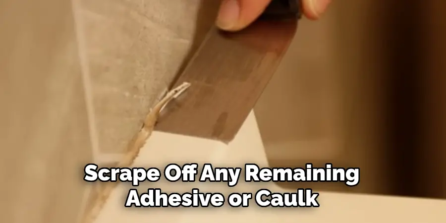 Scrape Off Any Remaining Adhesive or Caulk
