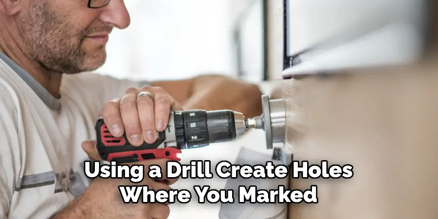 Using a Drill Create Holes Where You Marked