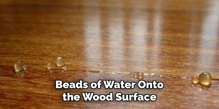 Beads of Water Onto the Wood Surface