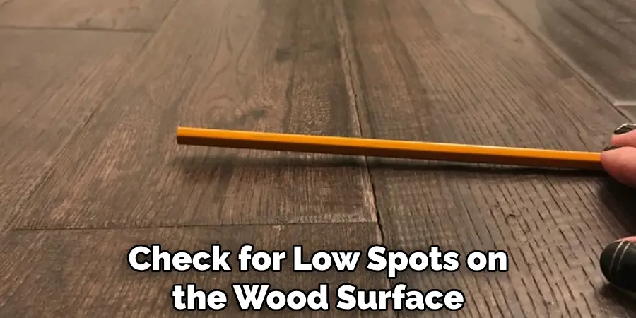 Check for Low Spots on the Wood Surface