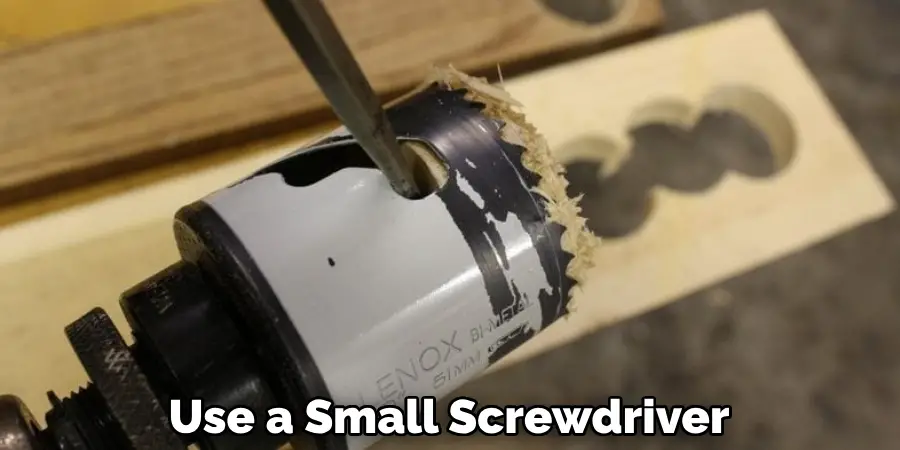 Use a Small Screwdriver