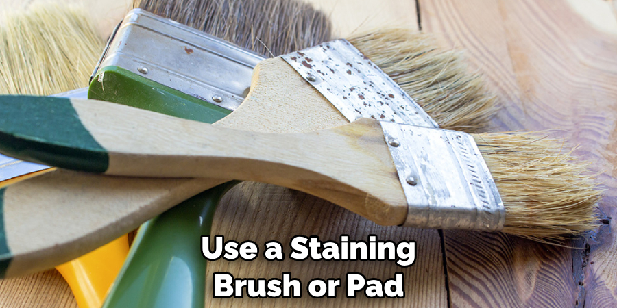 Use a Staining Brush or Pad