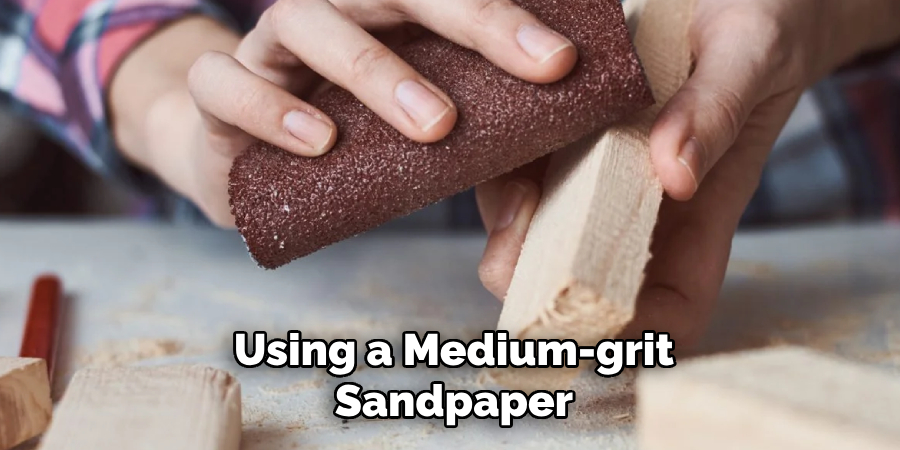 Using a Medium-grit Sandpaper