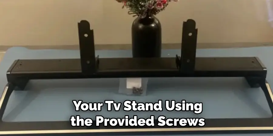 Your Tv Stand Using the Provided Screws