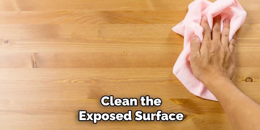 Clean the 
Exposed Surface